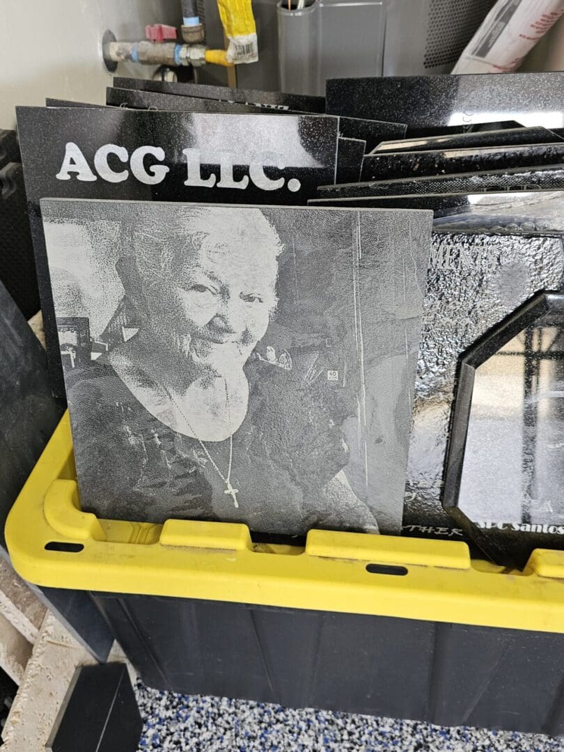 A black and white poster of a old woman kept in a basket