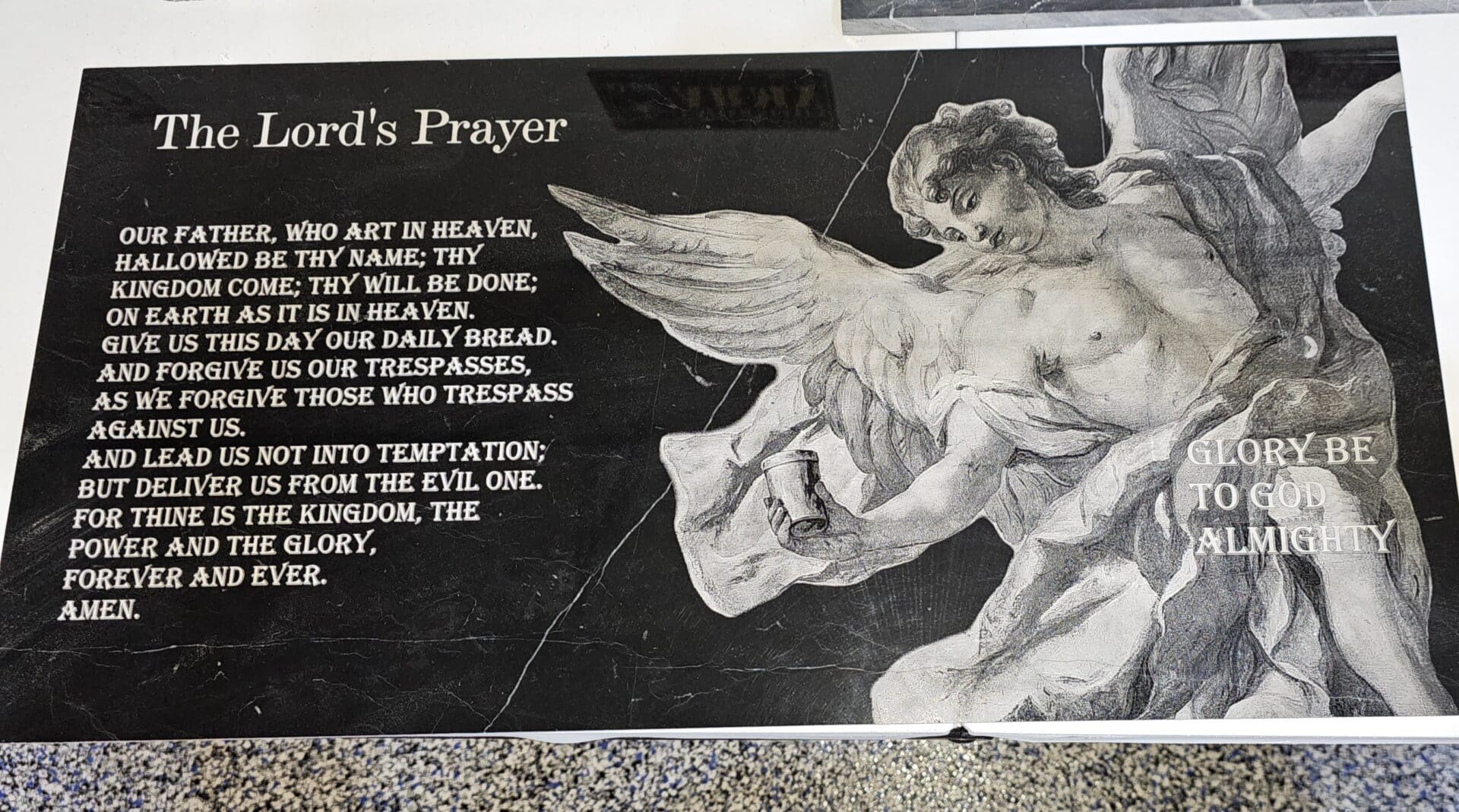 A poster of the lords prayer with a picture on it.