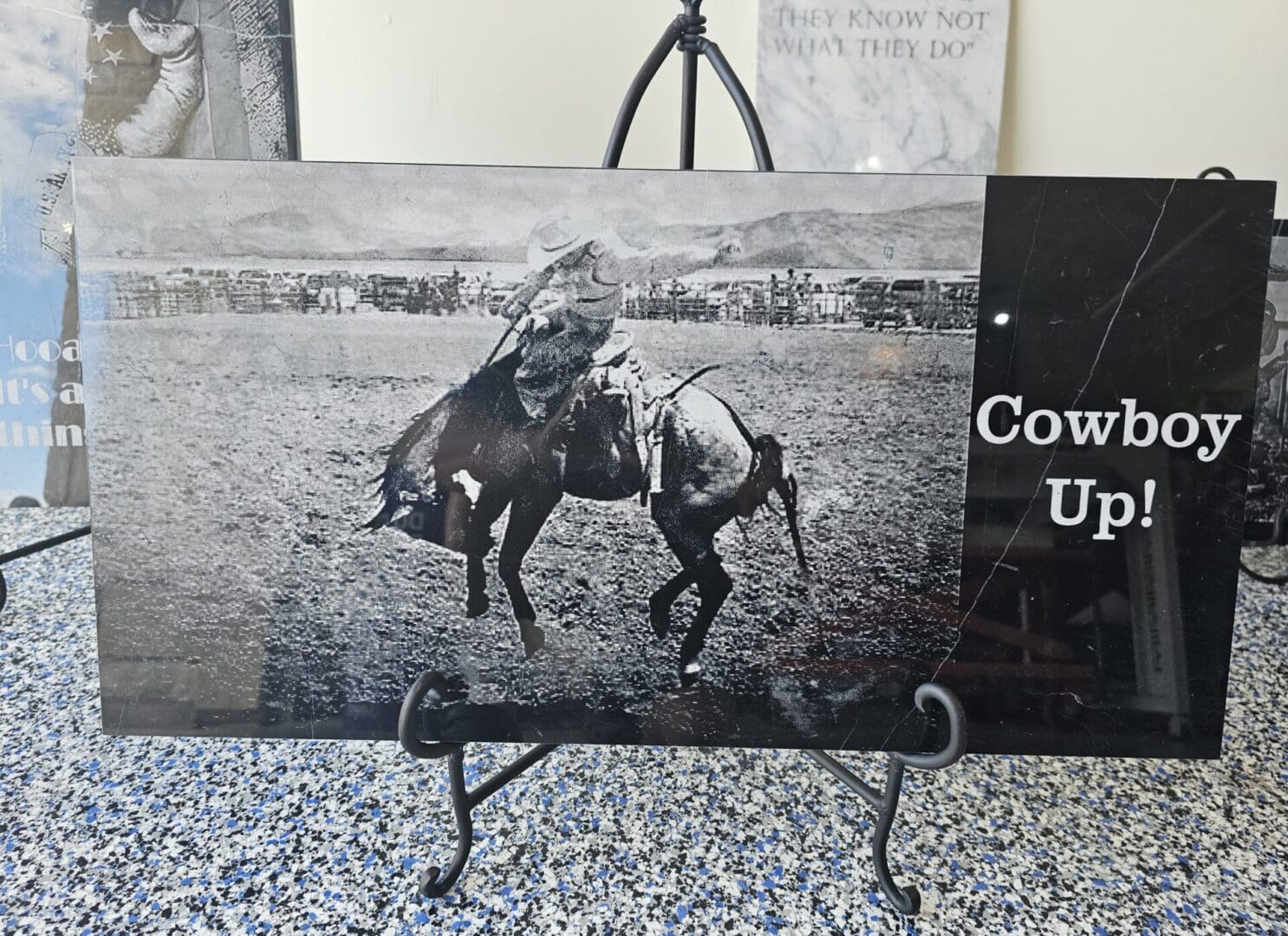 A black and white poster on display with a horse in it.